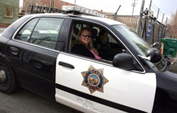 close up of squad car with happy rider